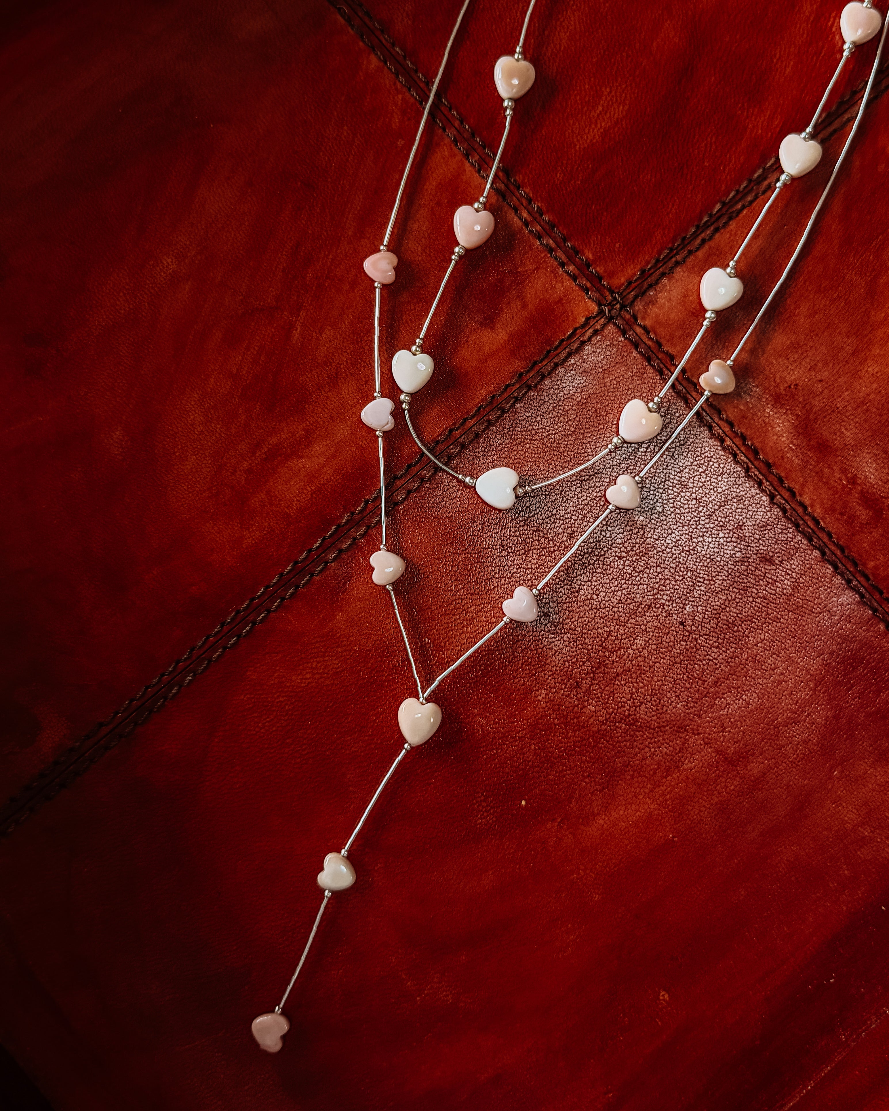 liquid silver Necklace or lariat necklace with heart-shaped pink conch beads