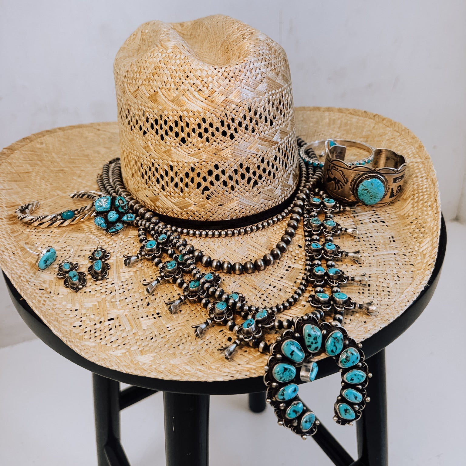Straw hat with turquoise jewelry