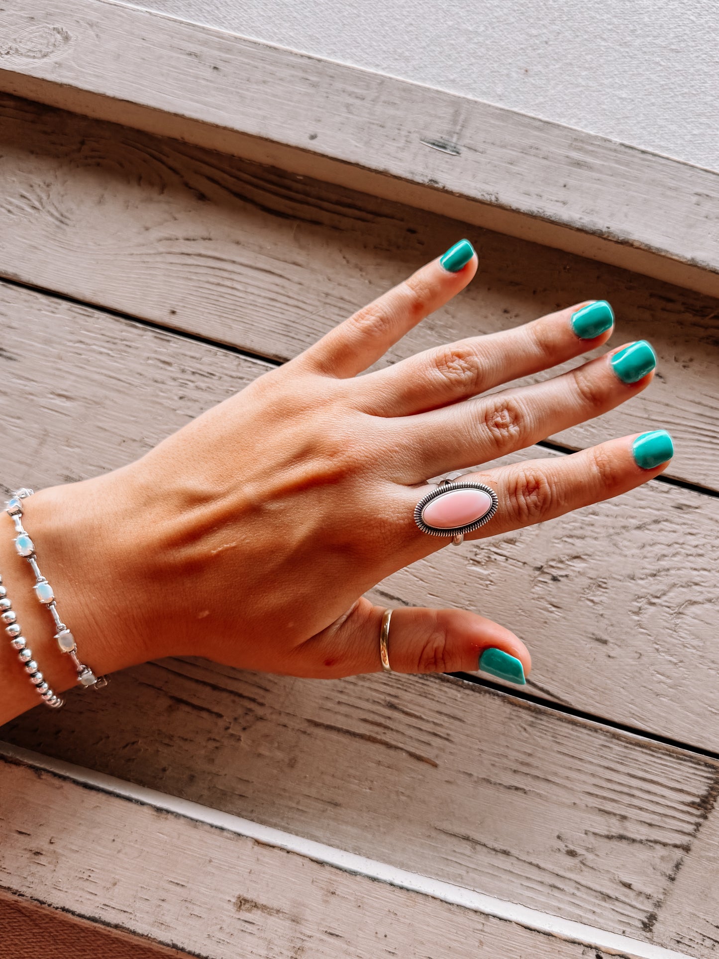 Six Gun Shooting Pink Conch Ring