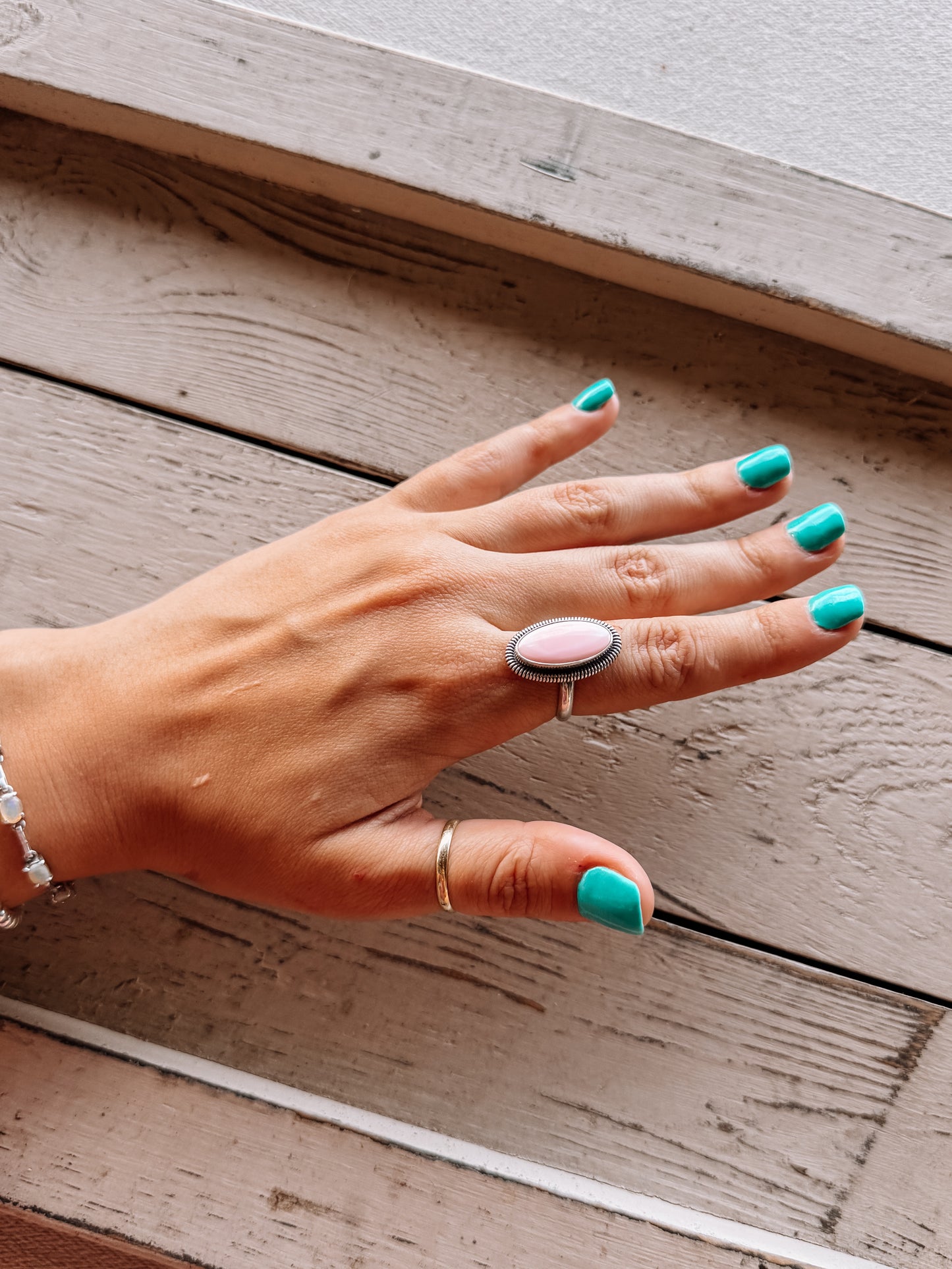 Six Gun Shooting Pink Conch Ring