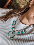 Two Stories Wide Turquoise Squash Blossom - Horseshoe J & Co.